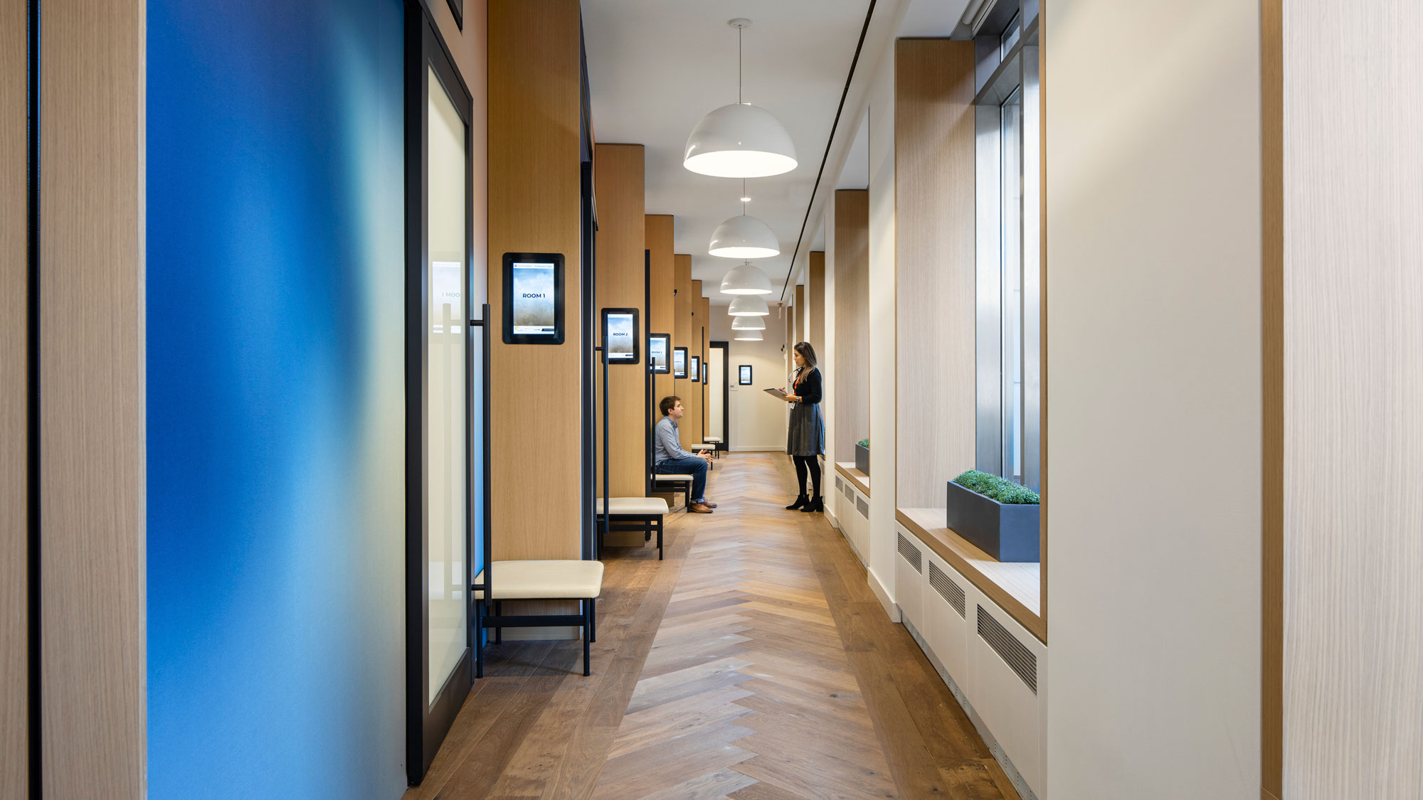 A person standing in a hallway.