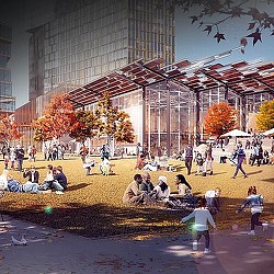 A group of people sitting on the ground outside of a building.