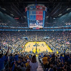 A crowd of people in a stadium.