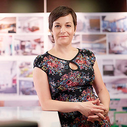 A woman in a floral dress.