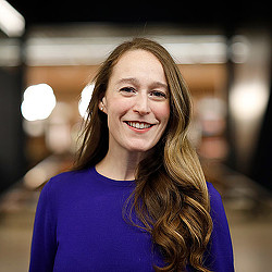 A woman smiling at the camera.