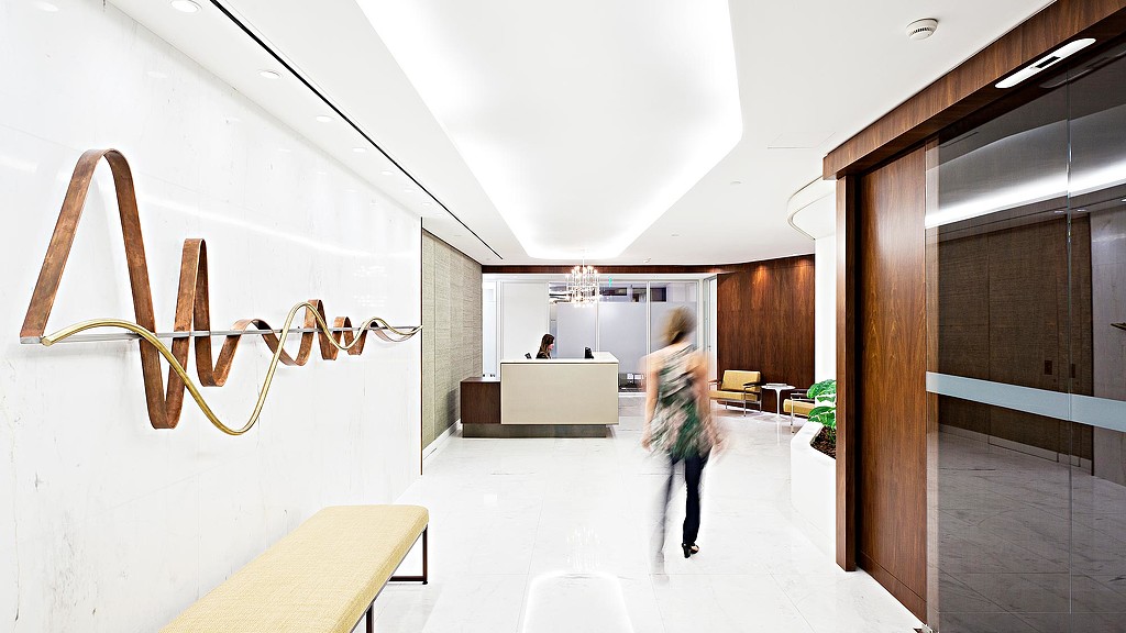 A person walking in a hallway.