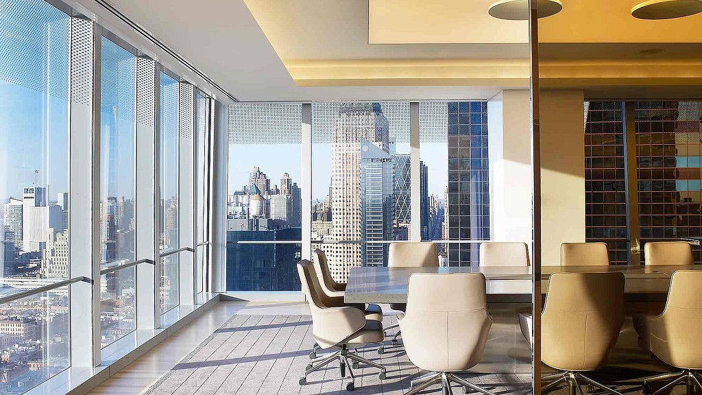 A room with a table and chairs.