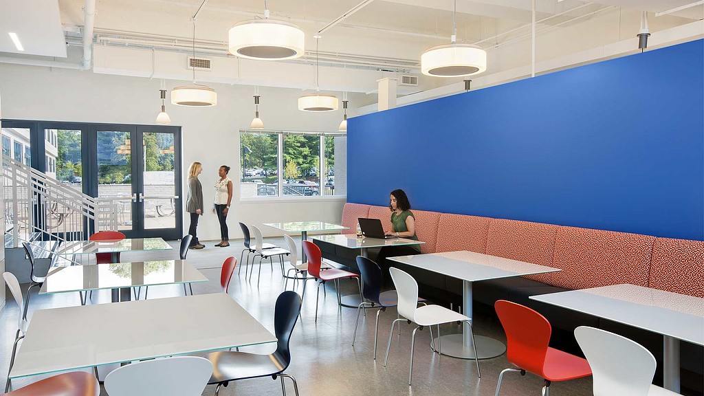 A room with tables and chairs.
