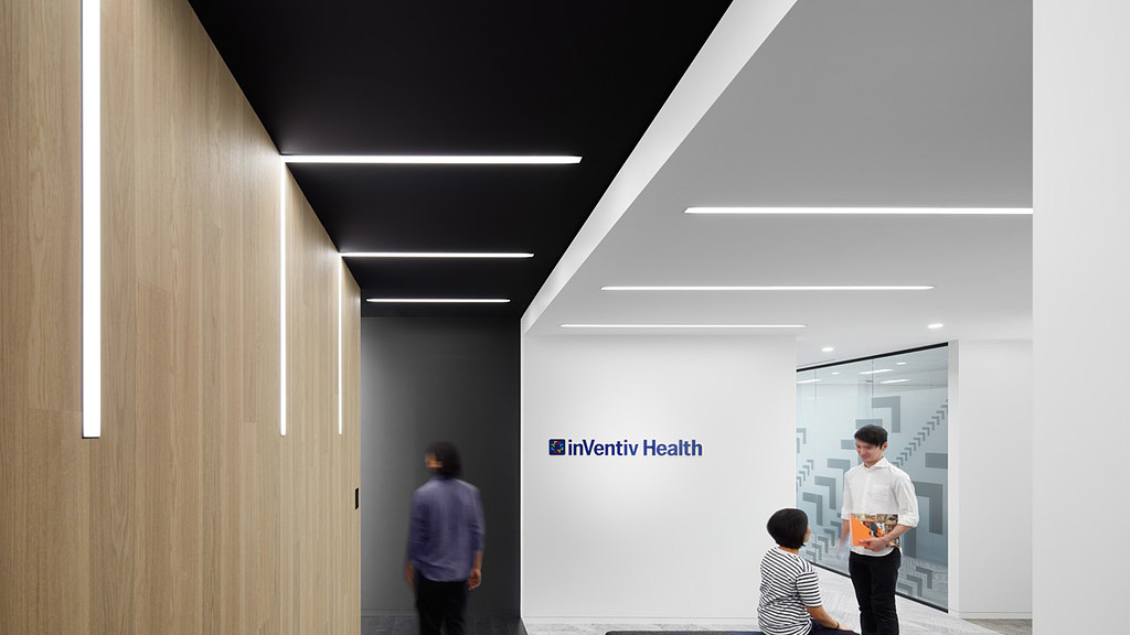 A group of people in a hallway.