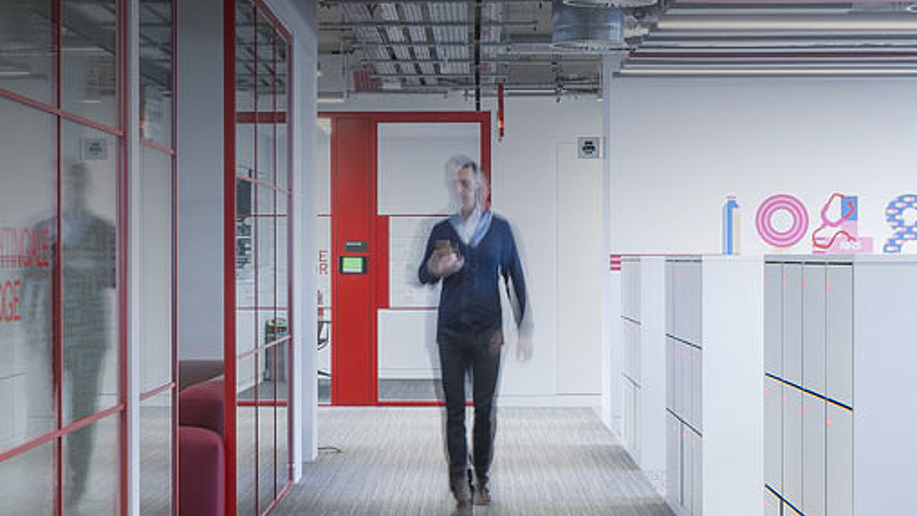 A person standing in a hallway.