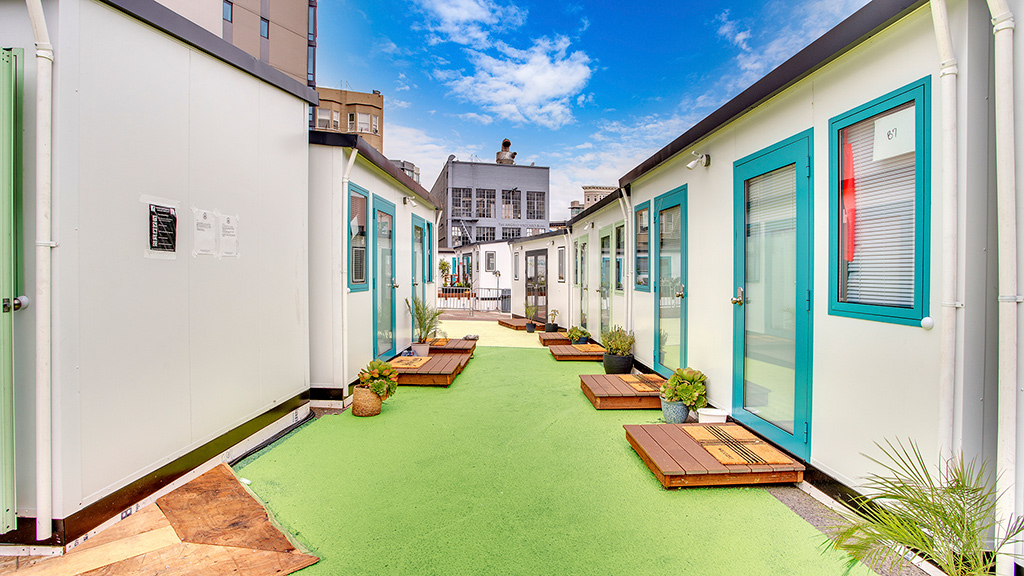 A row of buildings with a pool.