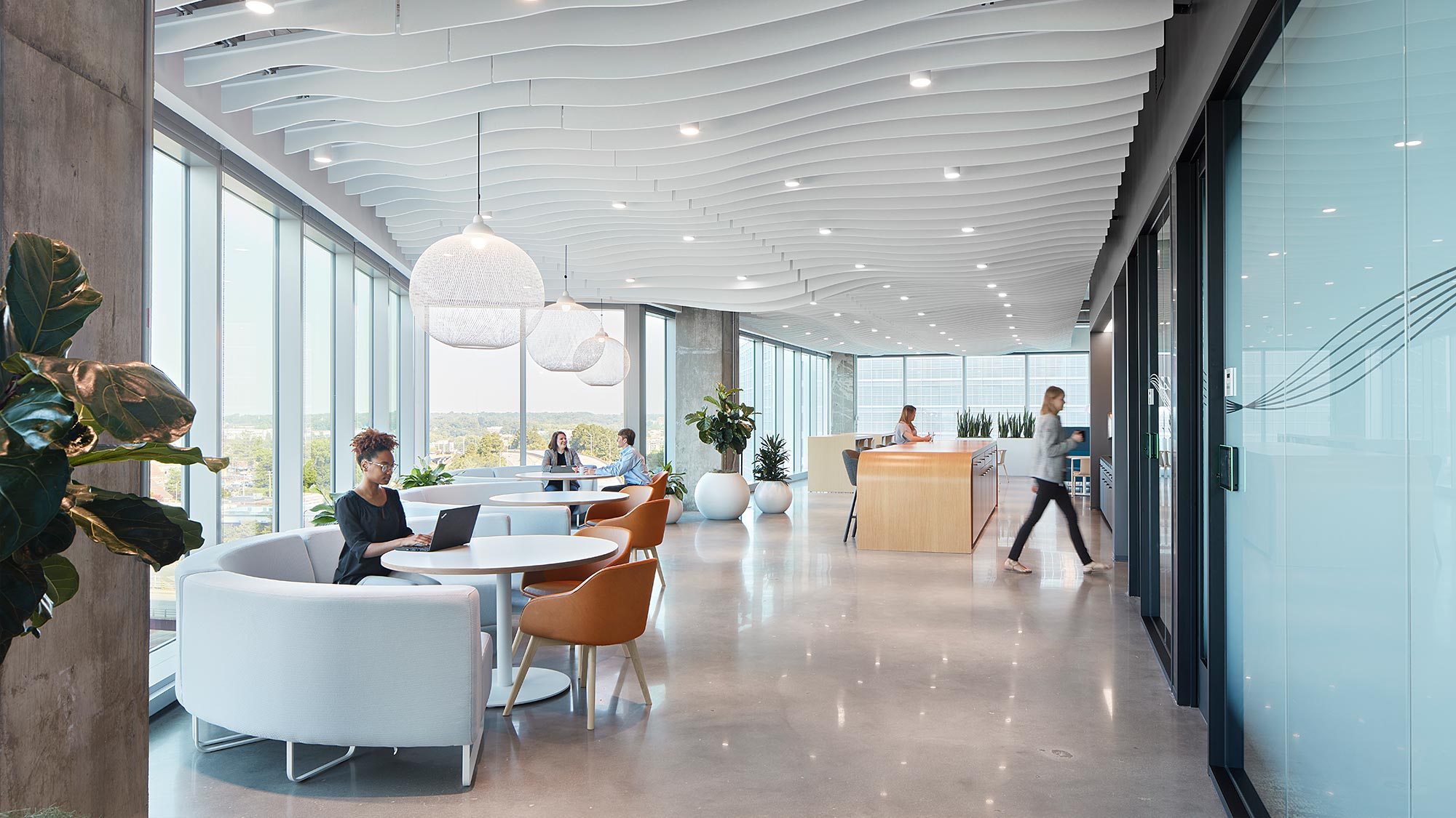 Employees working in cafe-style seating at JLL Charlotte headquarters