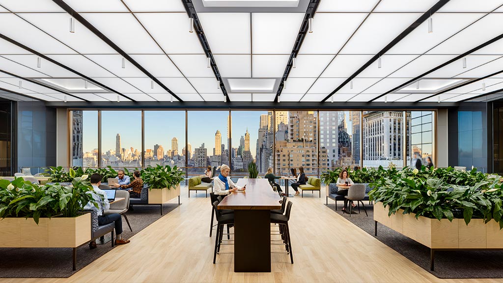 Confidential financial services firm open office with New York city views.