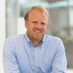A man smiling for the camera.