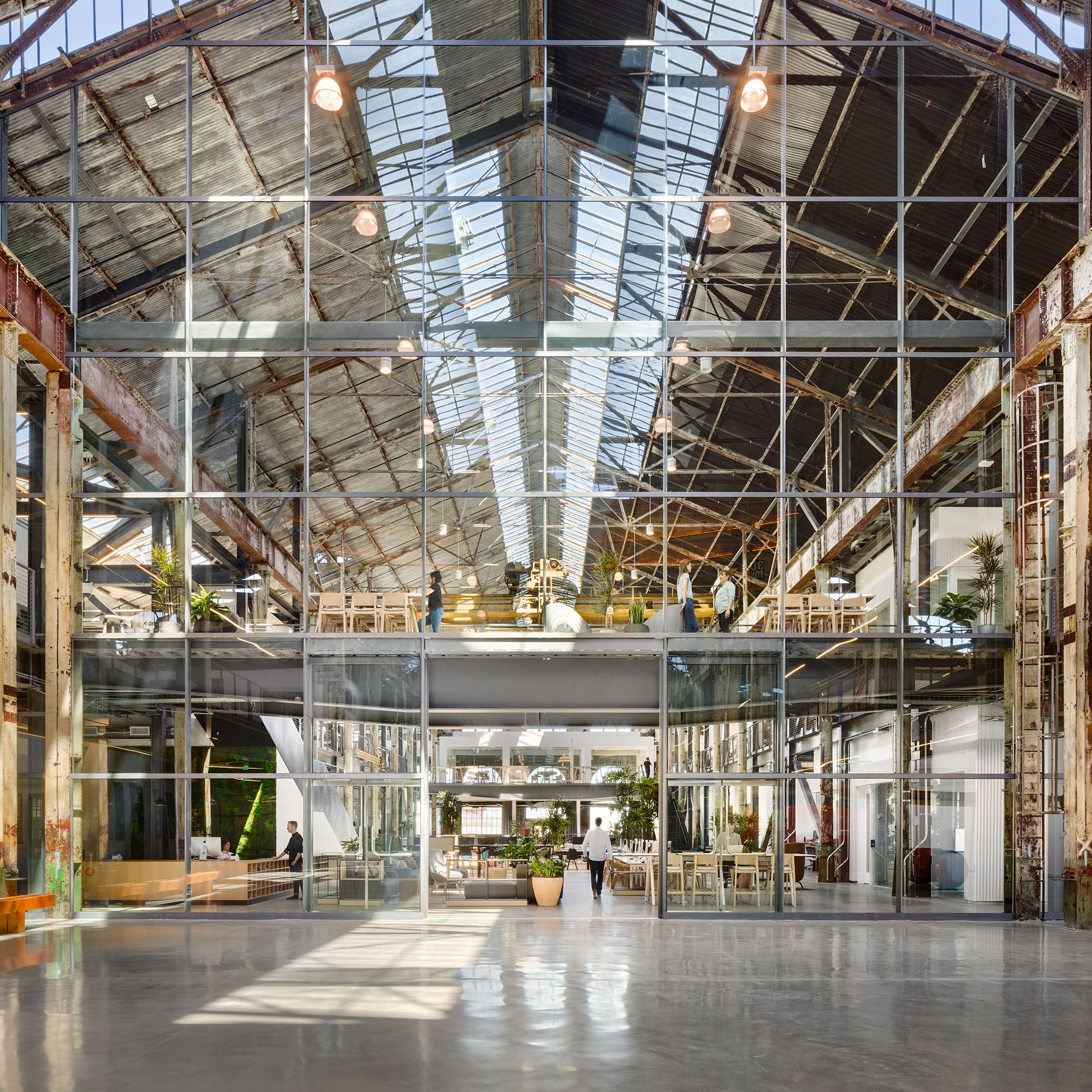 A large glass building with a large glass ceiling.