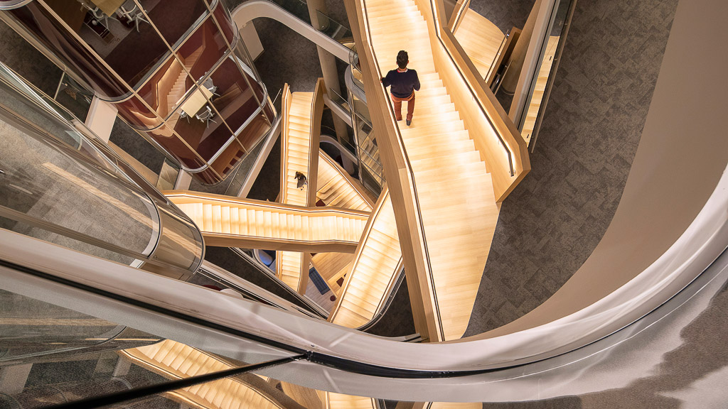 A person walking down a flight of stairs.