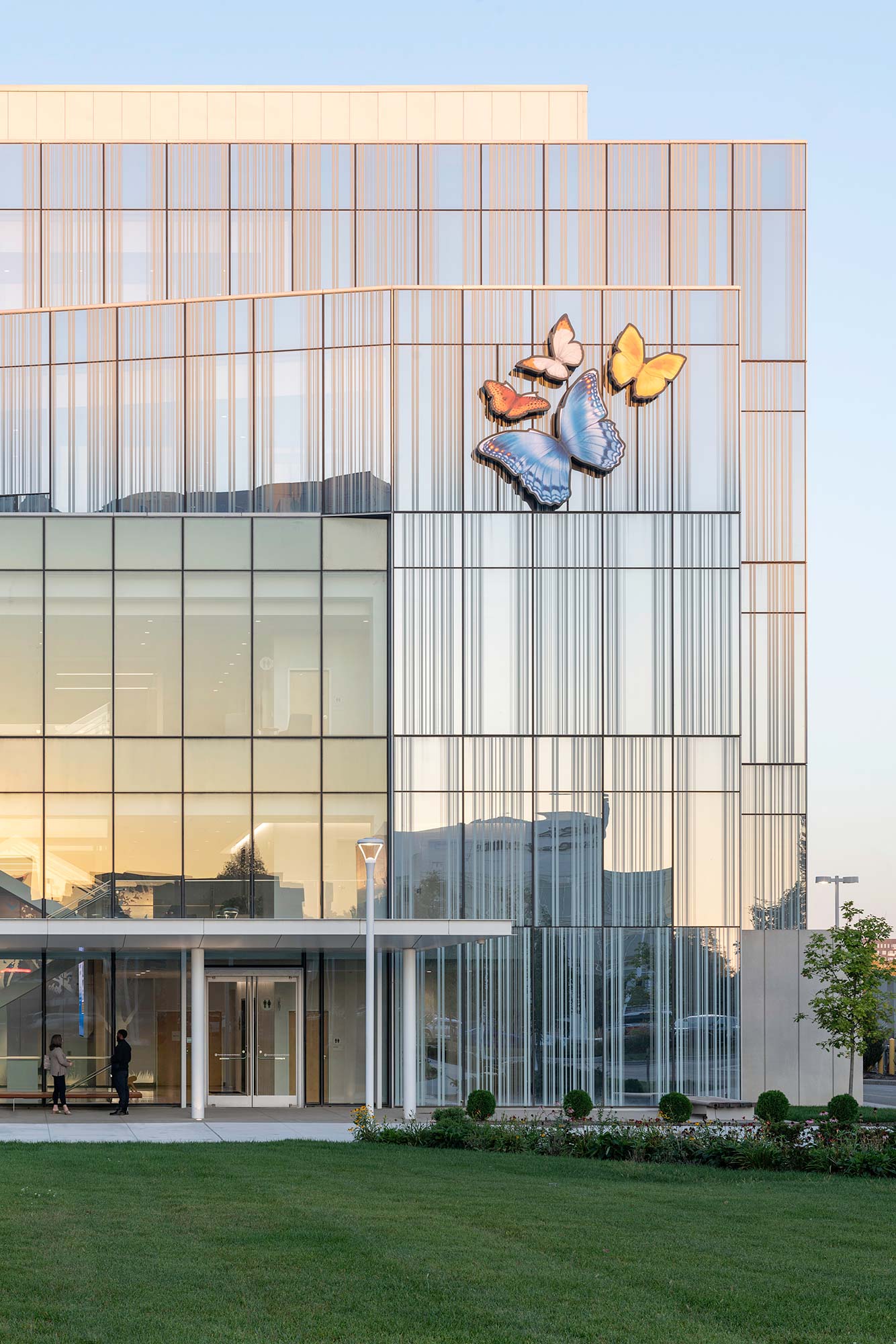 A large building with a large glass front.